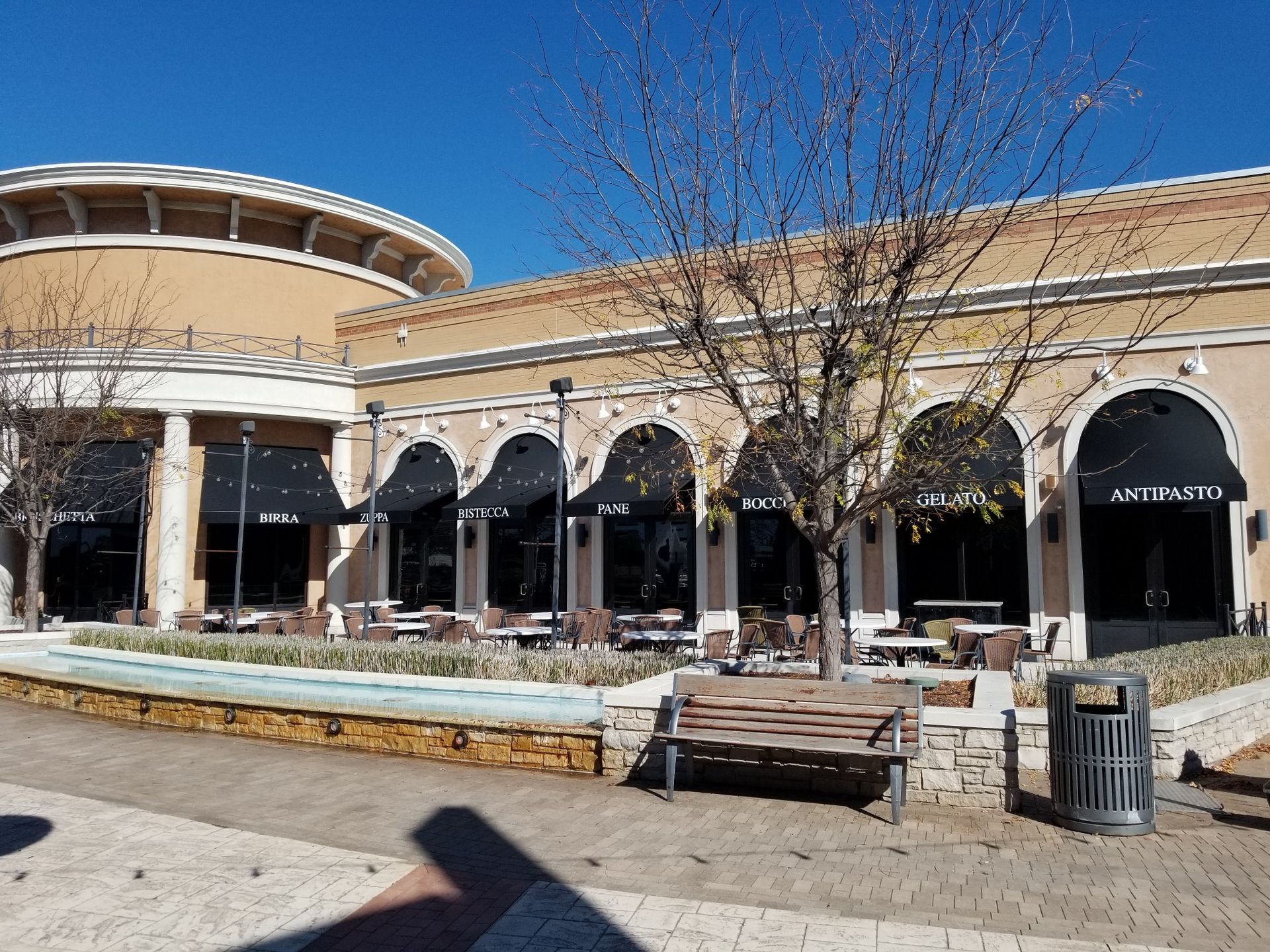 A large building with a fountain in front of it