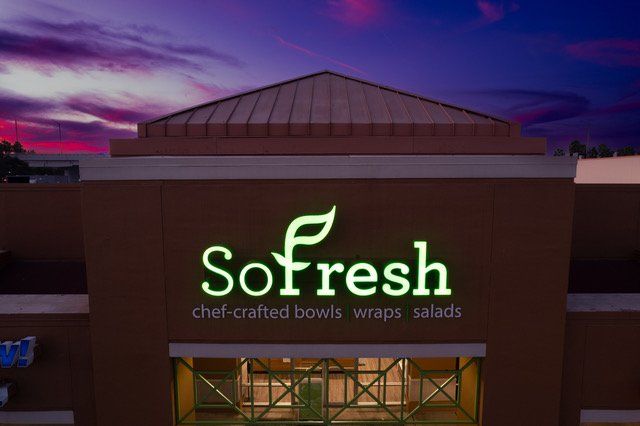 A sign for sofresh chef crafted bowls wraps salads