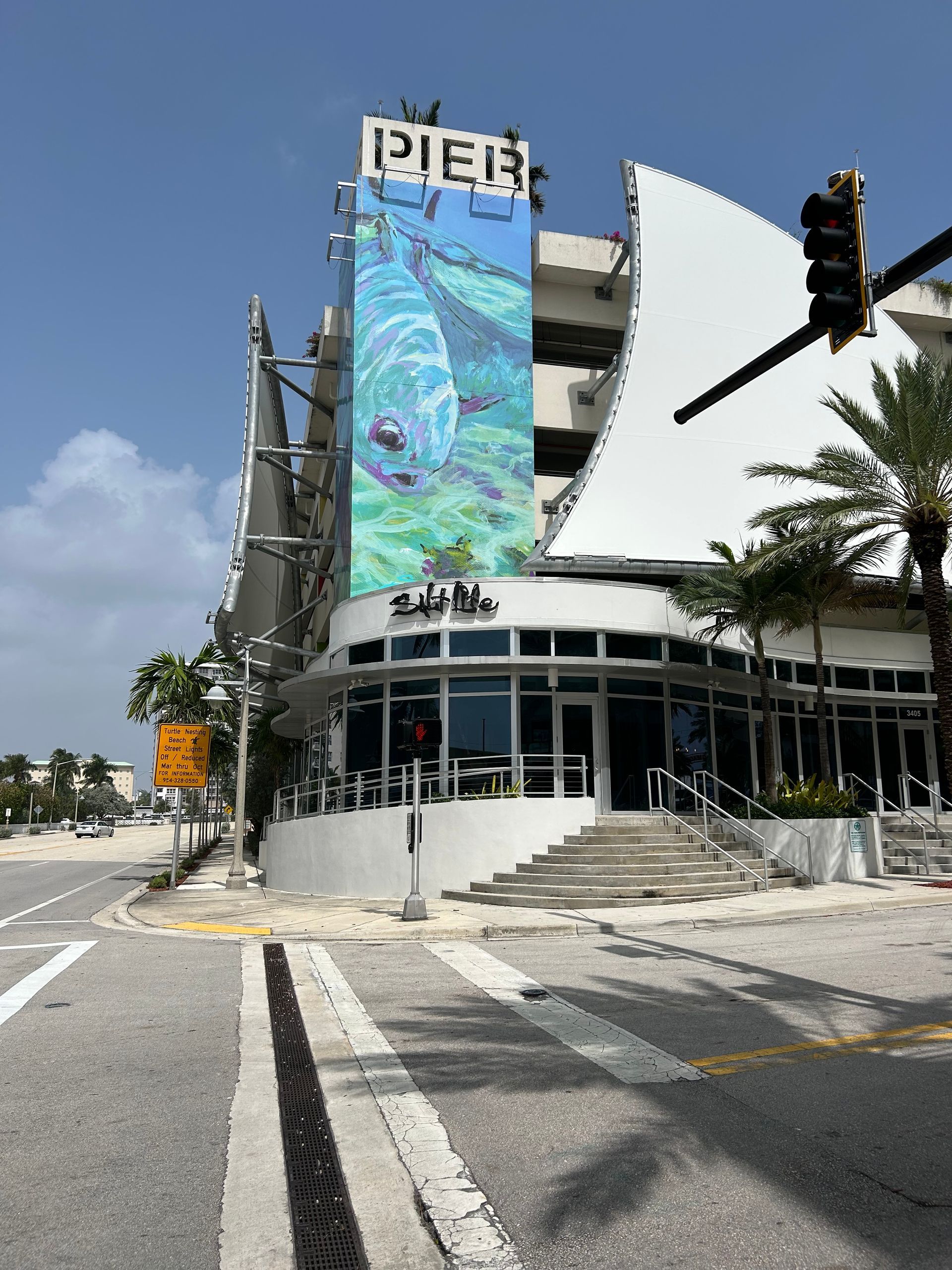 A pier building with a large mural on the side of it