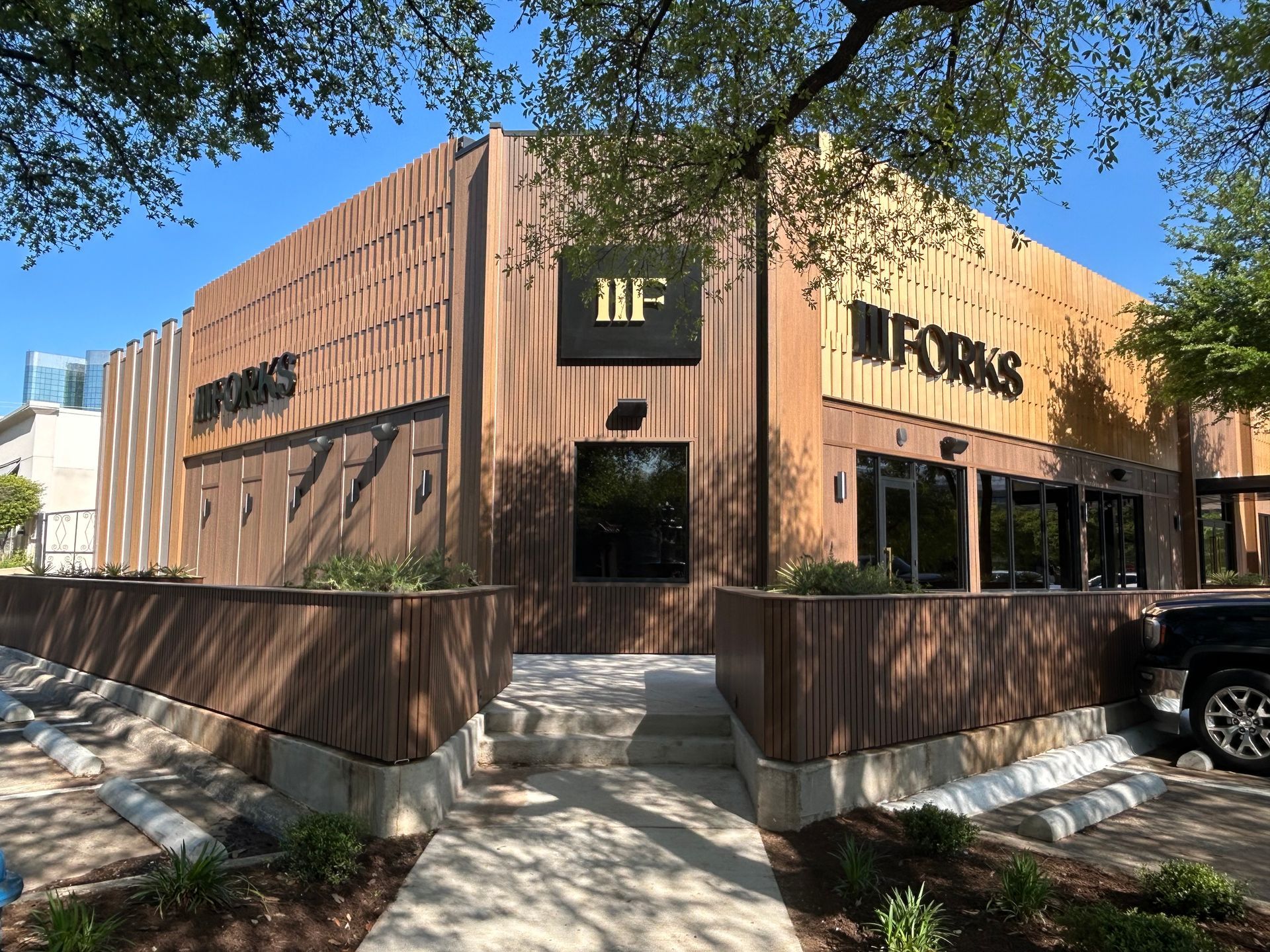 The front of a building with a sign that says ' if ' on it