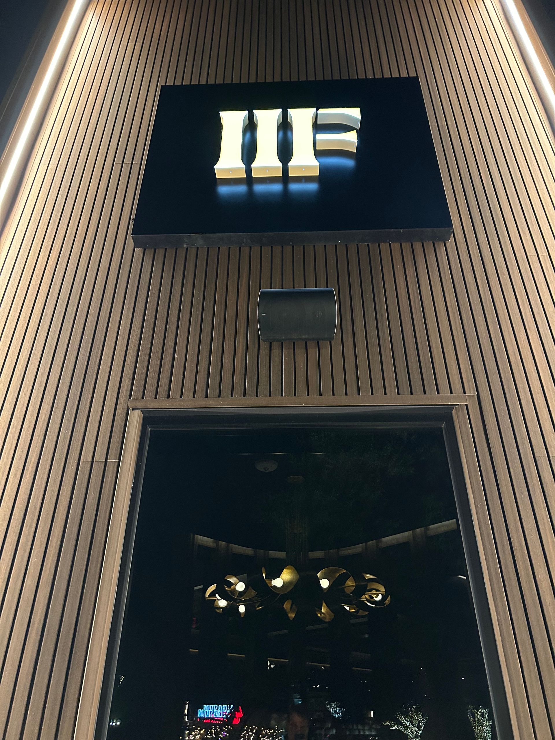 A sign on the side of a building that says iiif