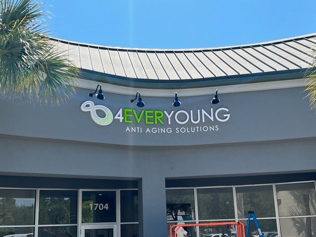 A building with a sign on it that says 4ever young anti aging solutions.