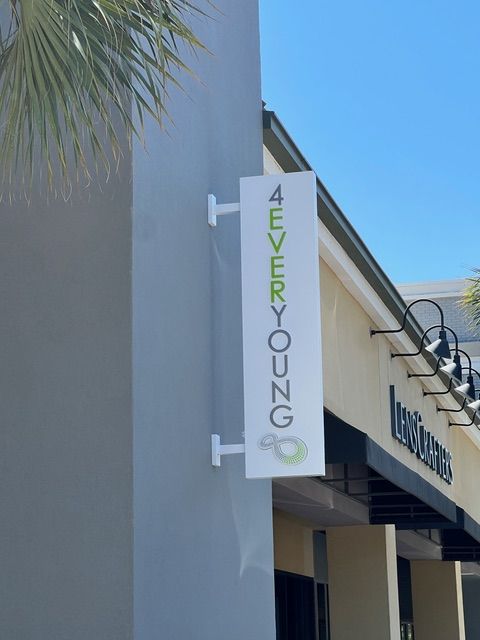 A sign on the side of a building that says 4 every young