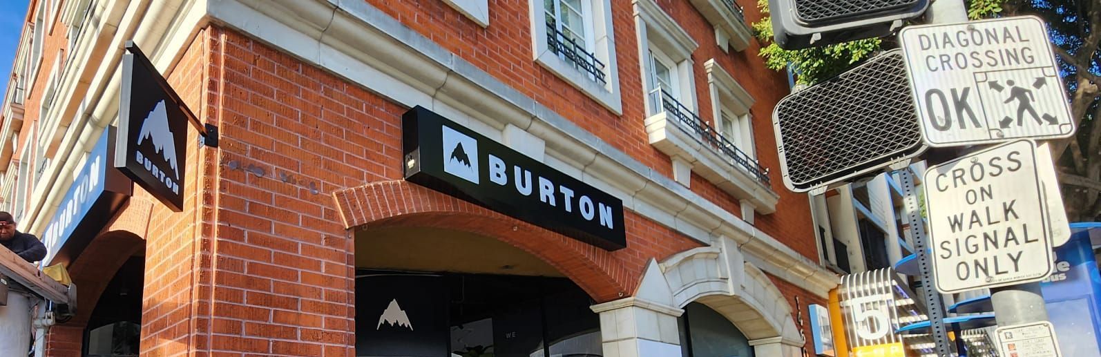 A brick building with a sign that says burton on it