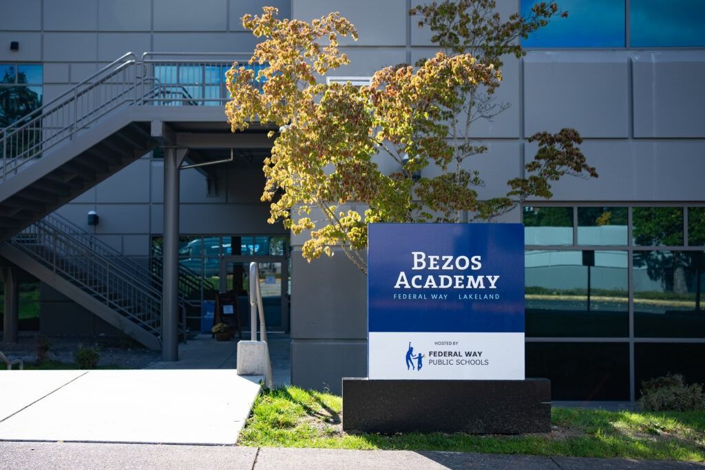 A building with stairs and a sign that says bezos academy