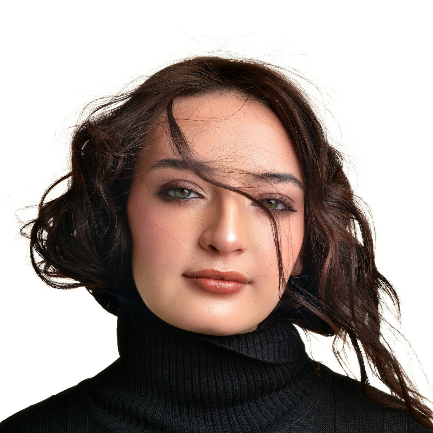 A calm studio portrait in even, unretouched light