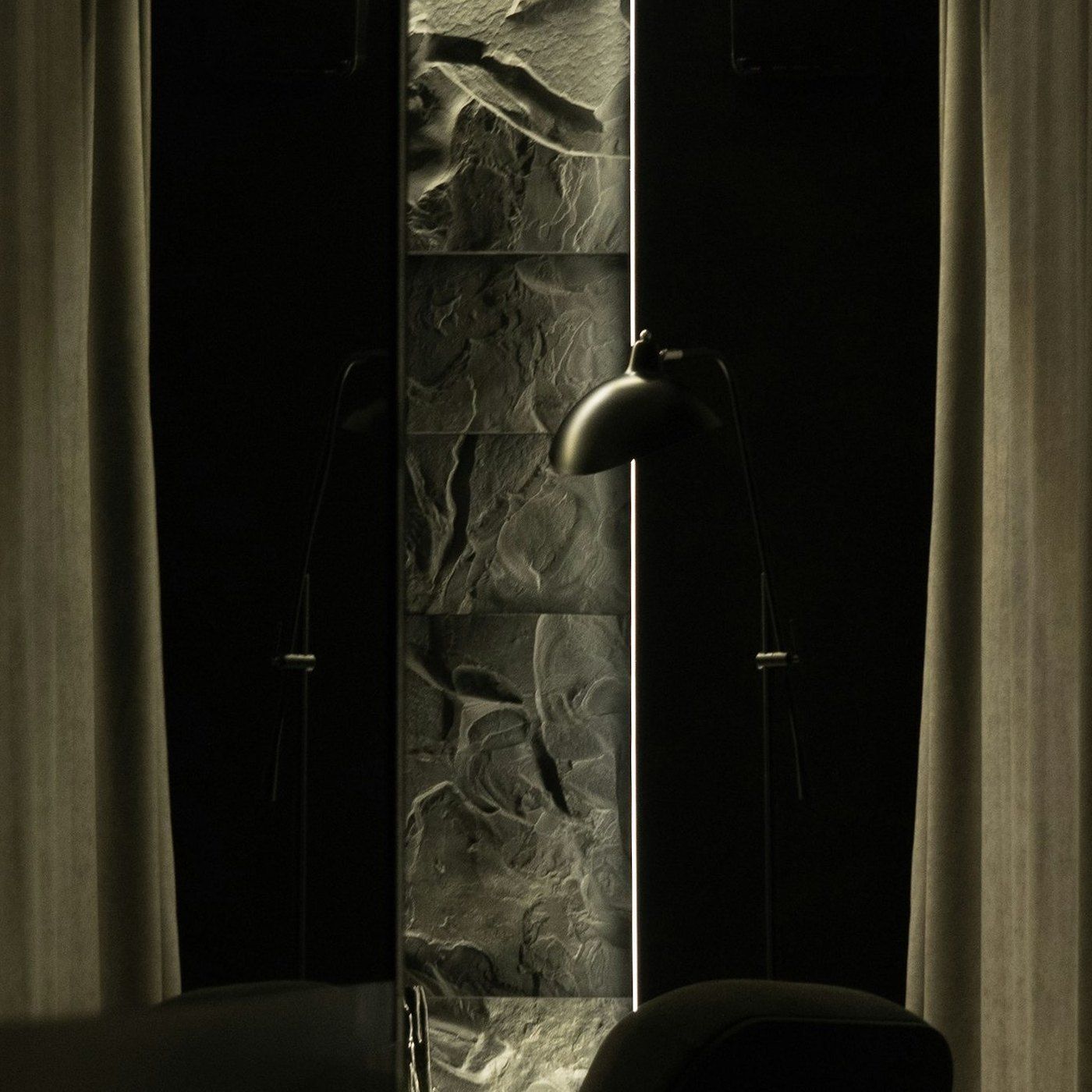 Dark stone and warm light, part of the Aevum visual language