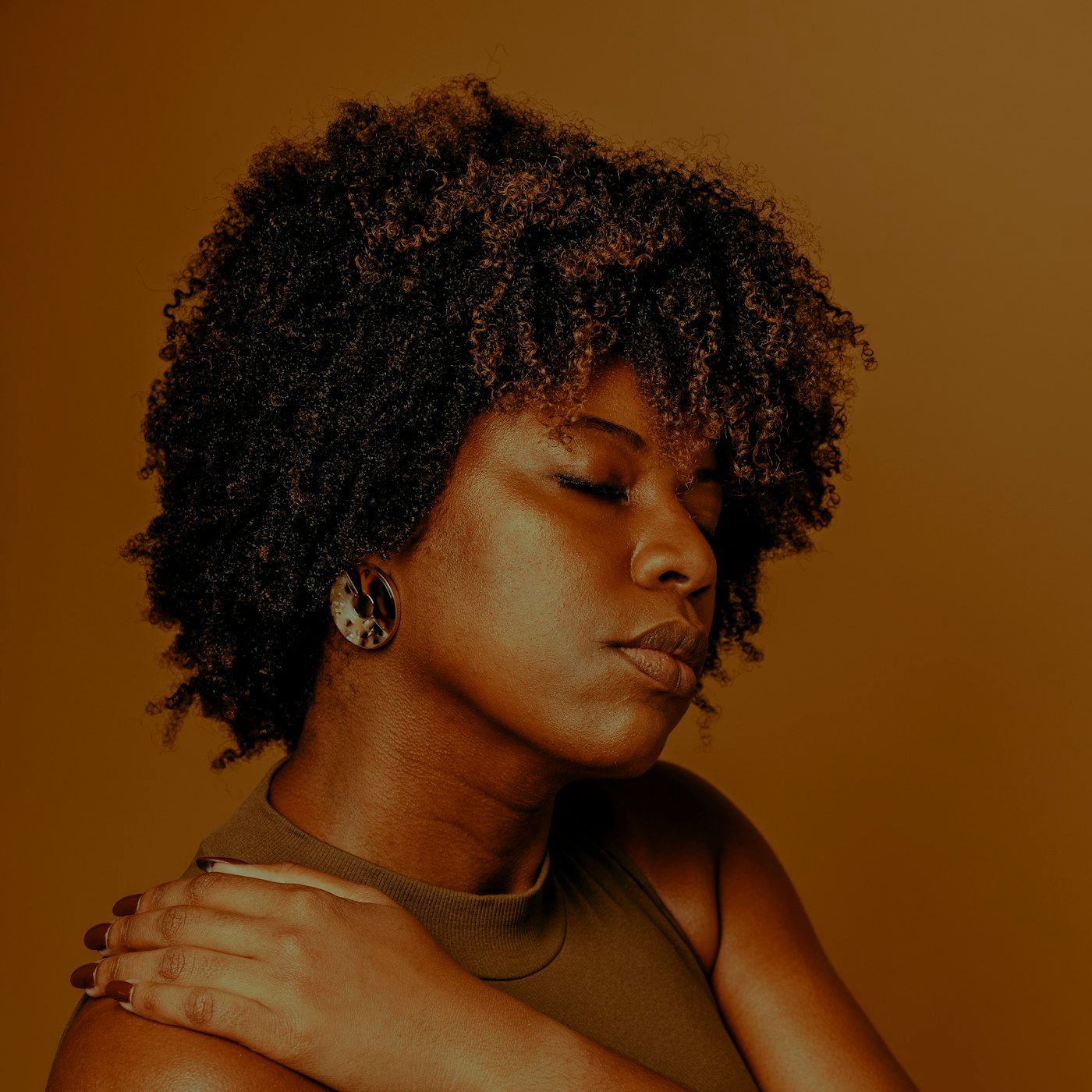 A lean, well conditioned figure in warm studio light