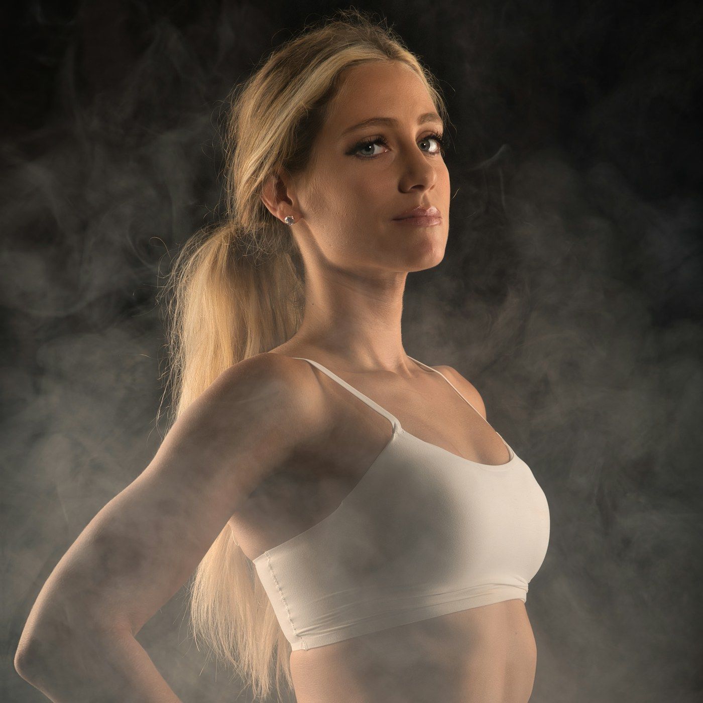 A lean, well conditioned figure in warm studio light