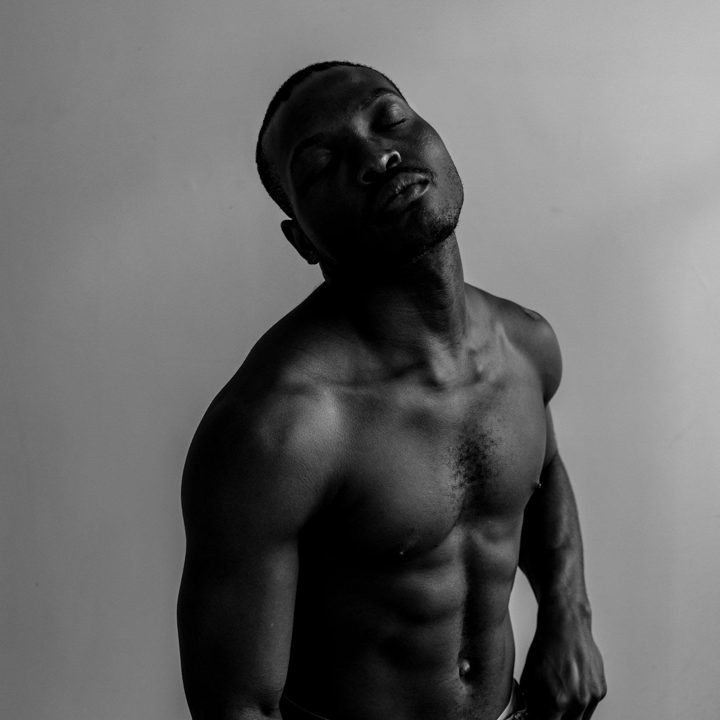 A composed studio portrait of a healthy, well conditioned adult