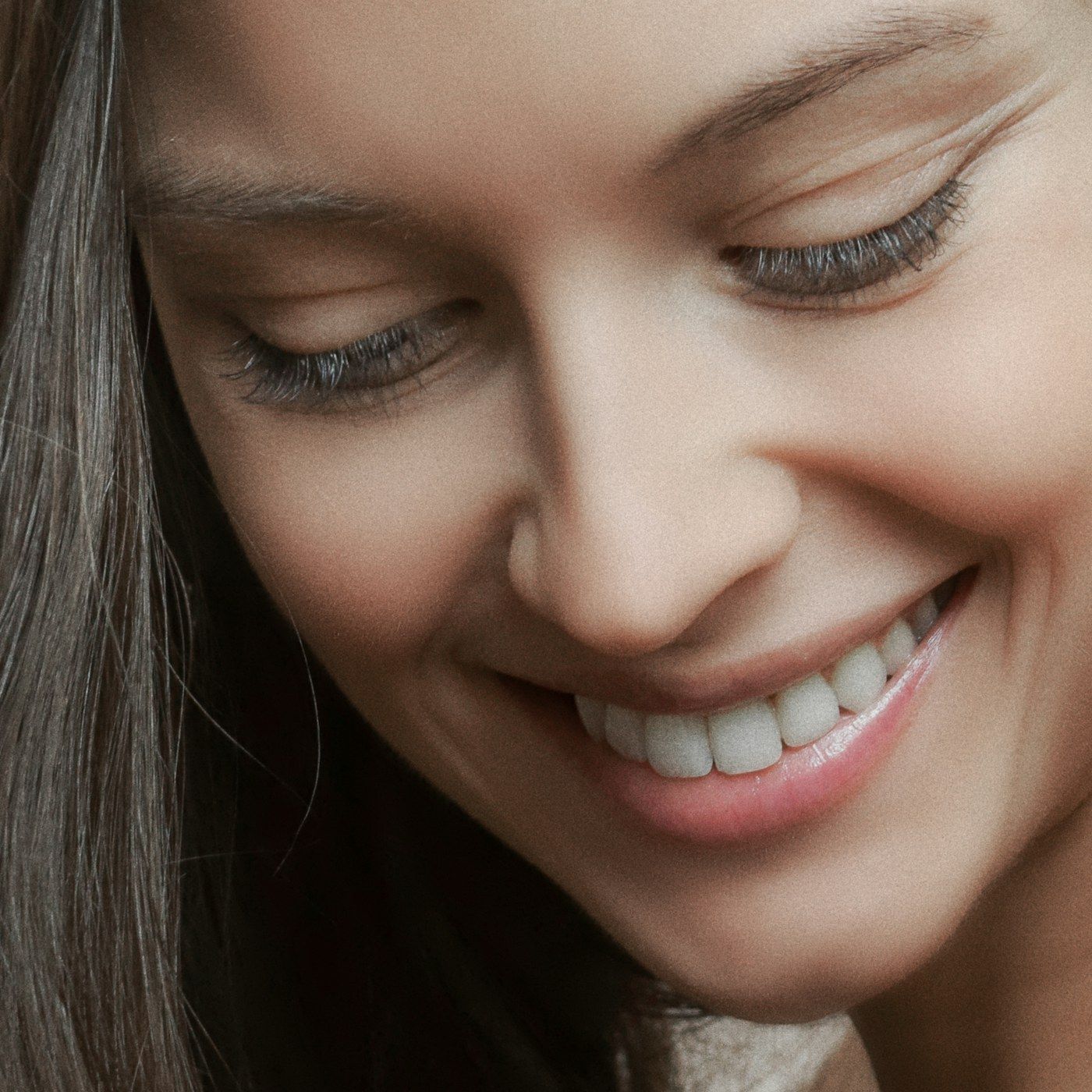 A relaxed, healthy woman in warm natural light