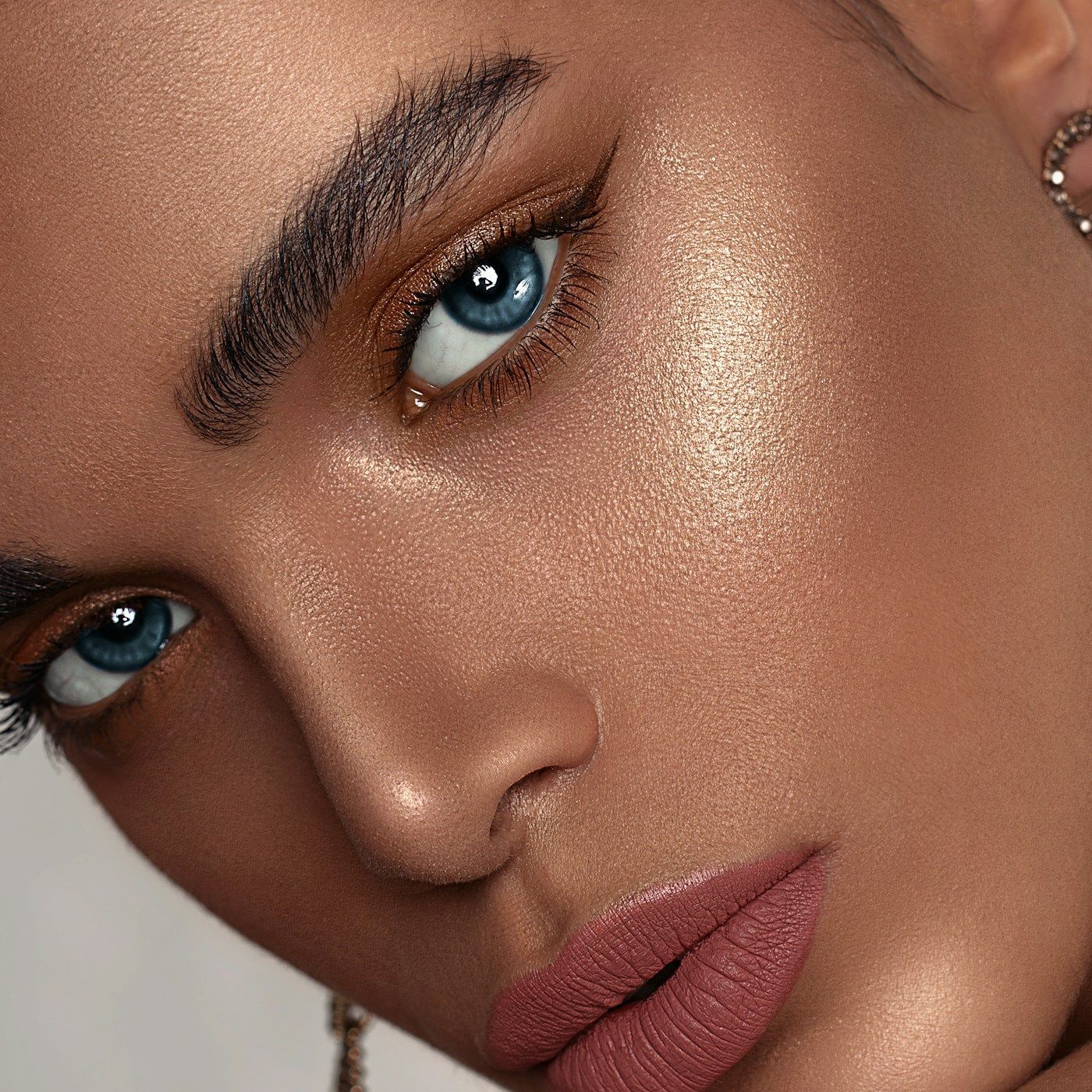 Luminous, dewy skin in close detail