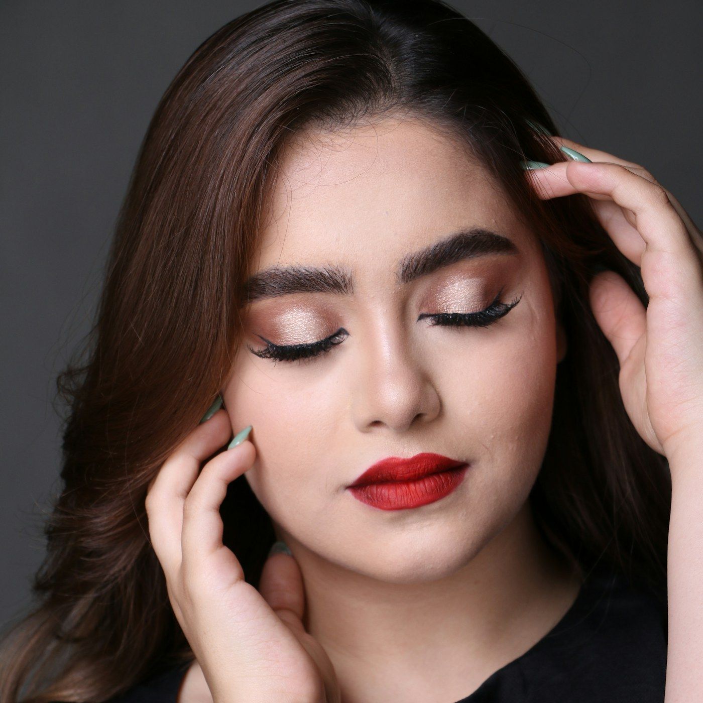 A close portrait showing a defined natural brow line