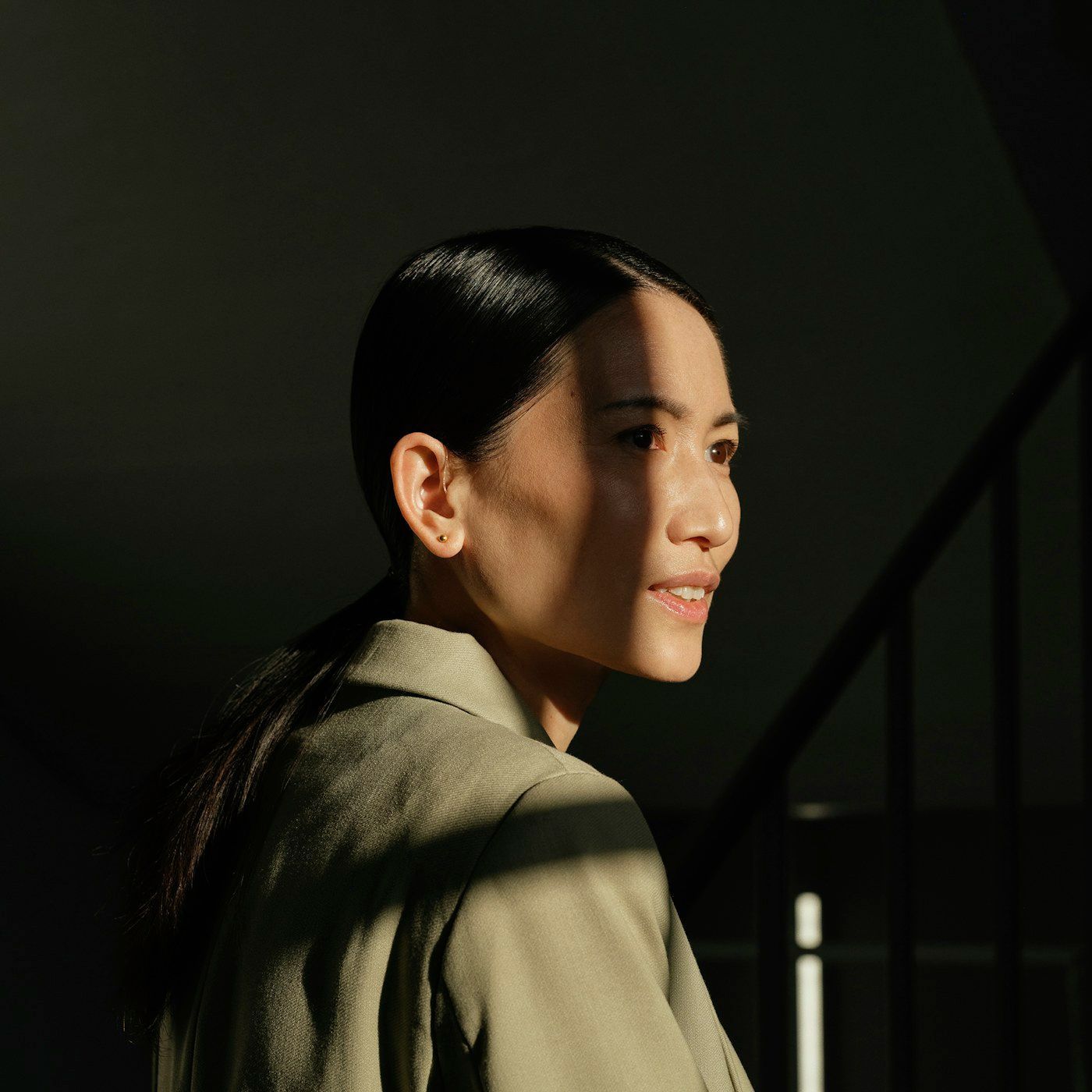 Warm side light across the cheek and temple in profile