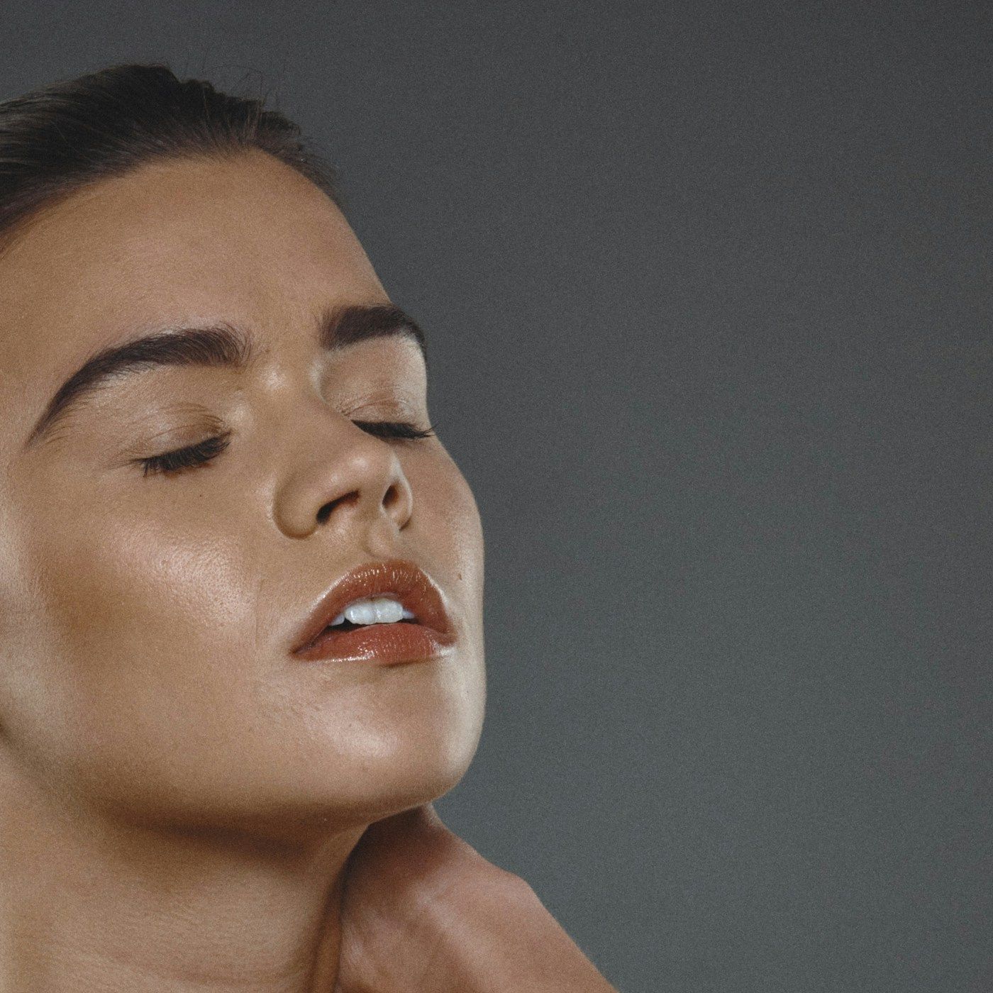 A lifted chin showing definition through the jaw and neck