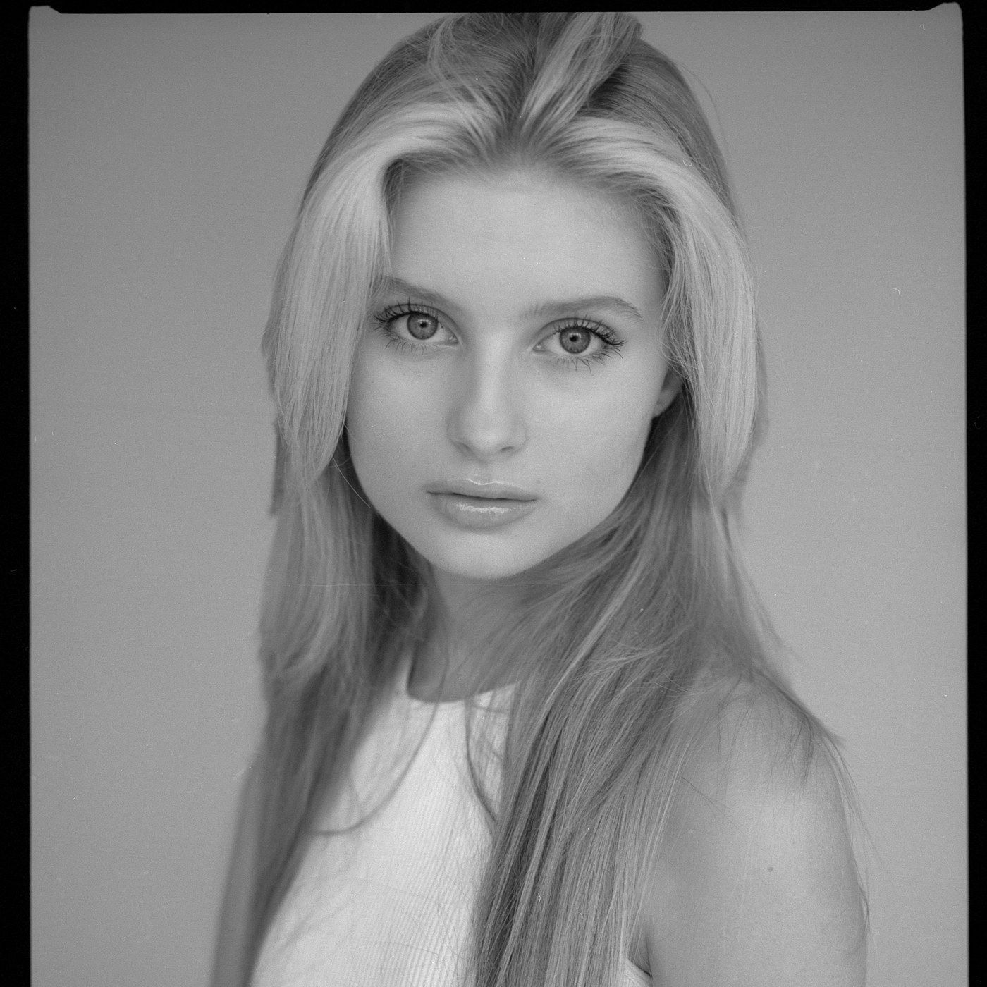 A serene studio portrait with smooth, healthy skin
