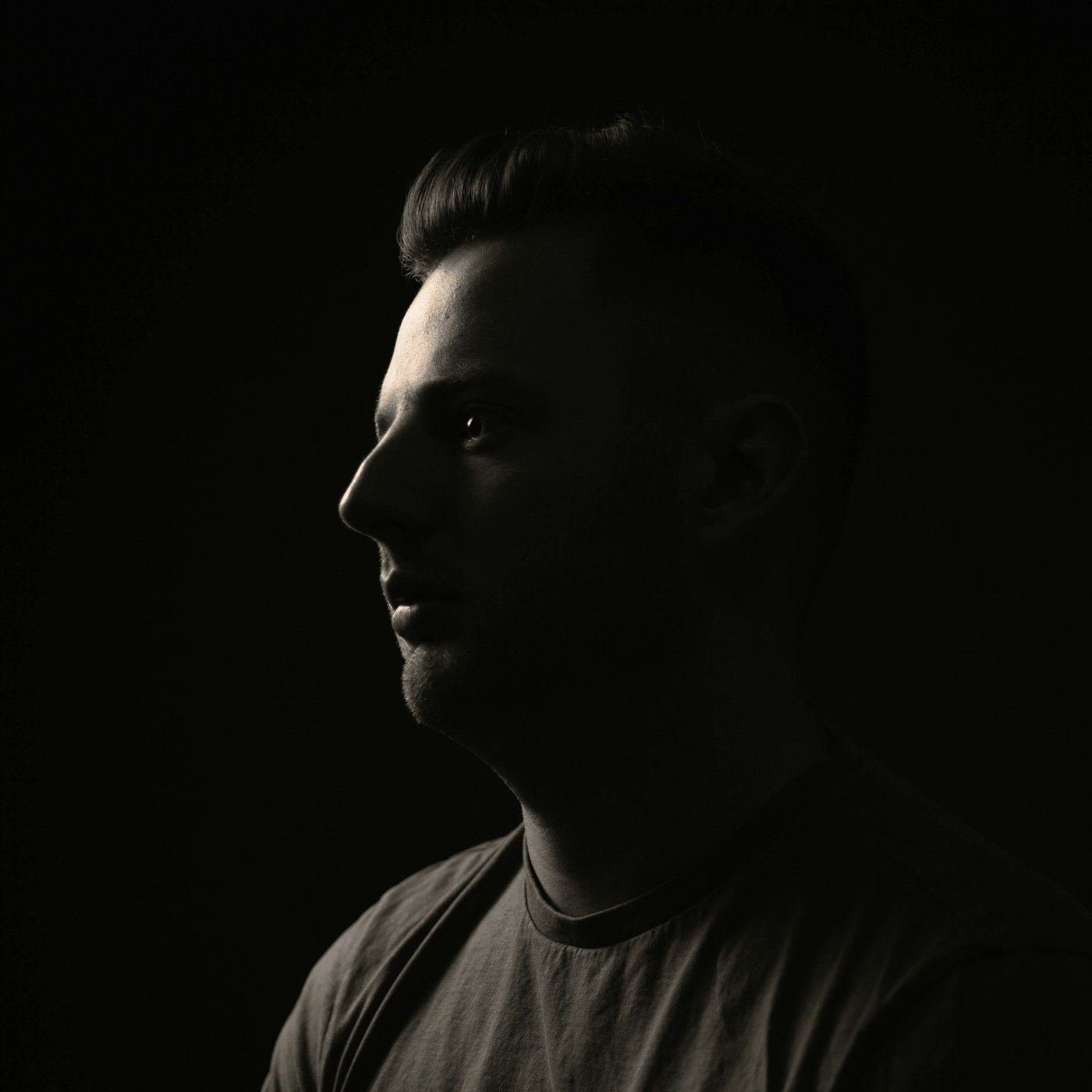 A calm studio portrait showing smooth skin texture