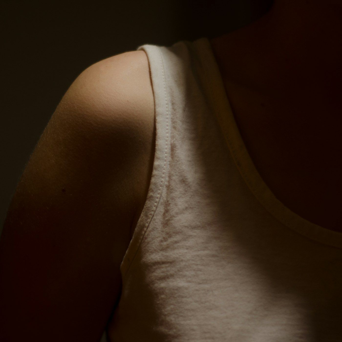 Warm studio light falling across clear, even skin