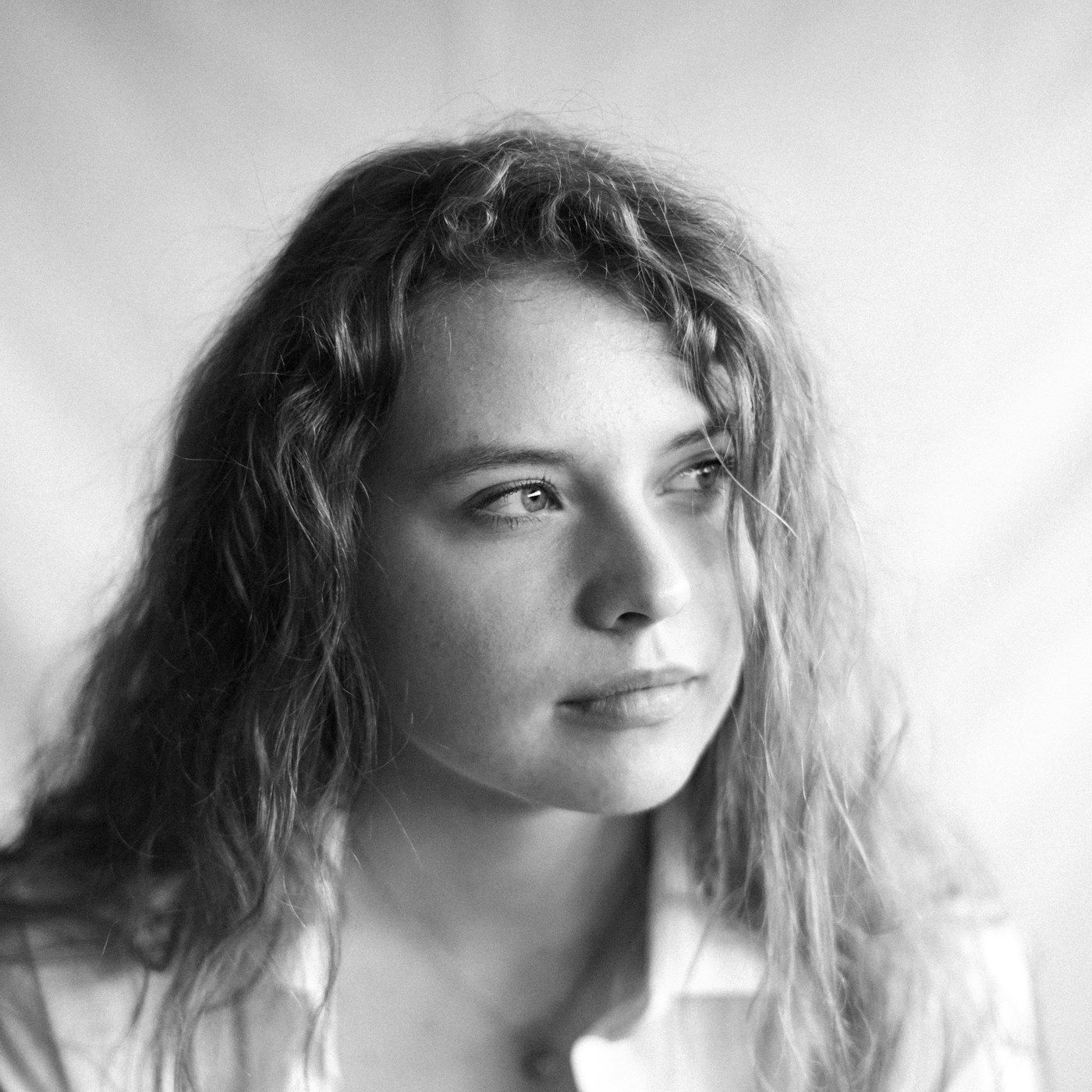 A calm studio portrait showing healthy, unmarked skin