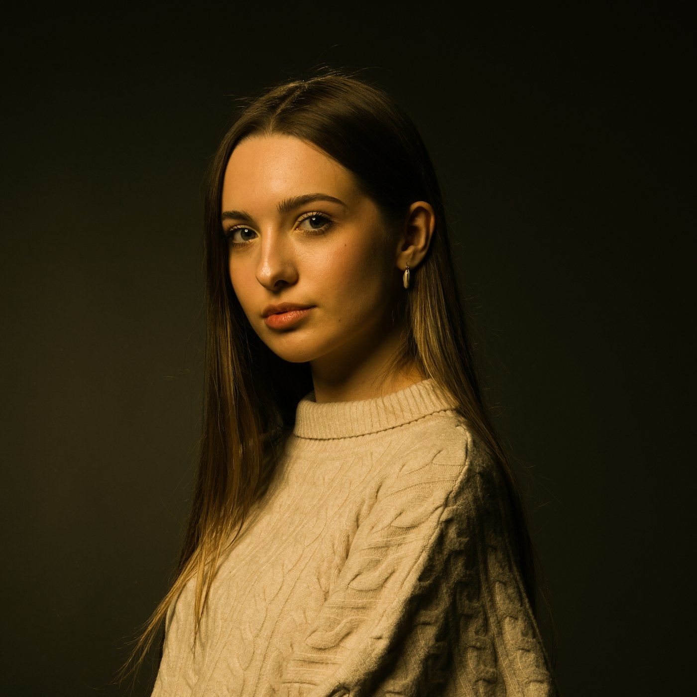 A composed studio portrait showing healthy, calm skin