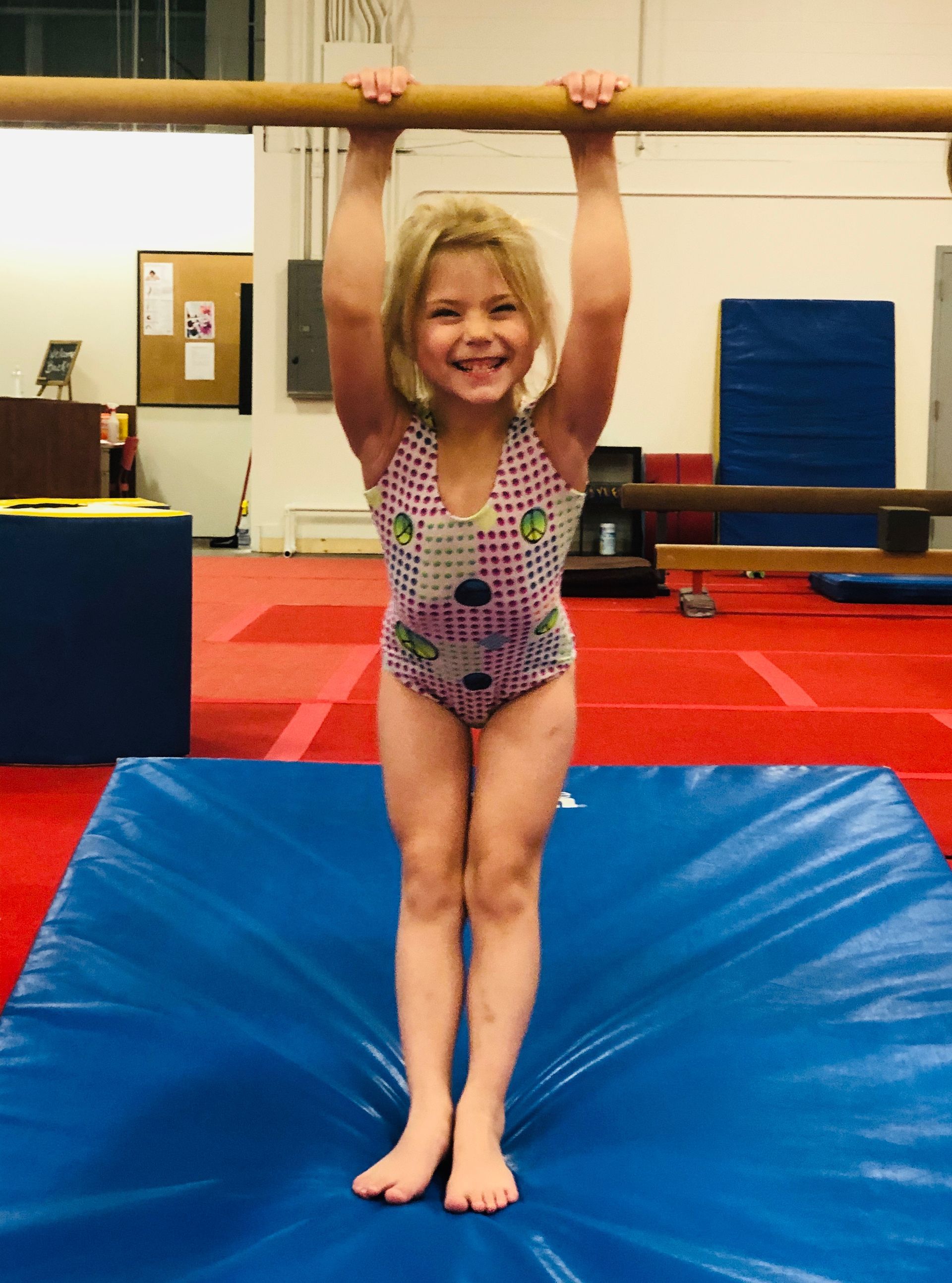 girl swinging on the bar