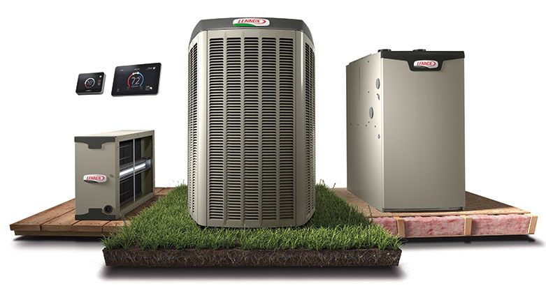 Three HVAC units on display on wooden platforms with grass accents