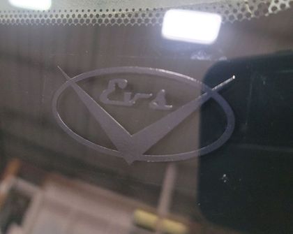 A car windshield with the word era etched into it