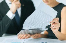 Person looking at piece of paper on a clipboard clipboard