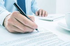 Man signing document