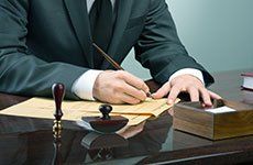 Man signing a document