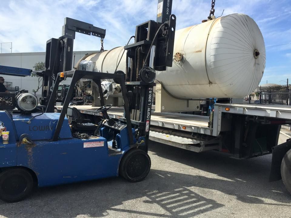 Forklift Operator Loading Boxes in Warehouse — Bell Gardens, CA — Santa Fe BG Machinery Movers