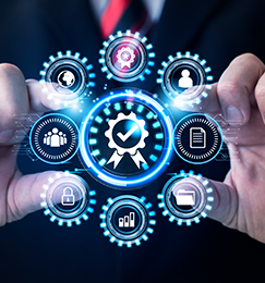A man in a suit and tie is holding a circle of icons in his hands.