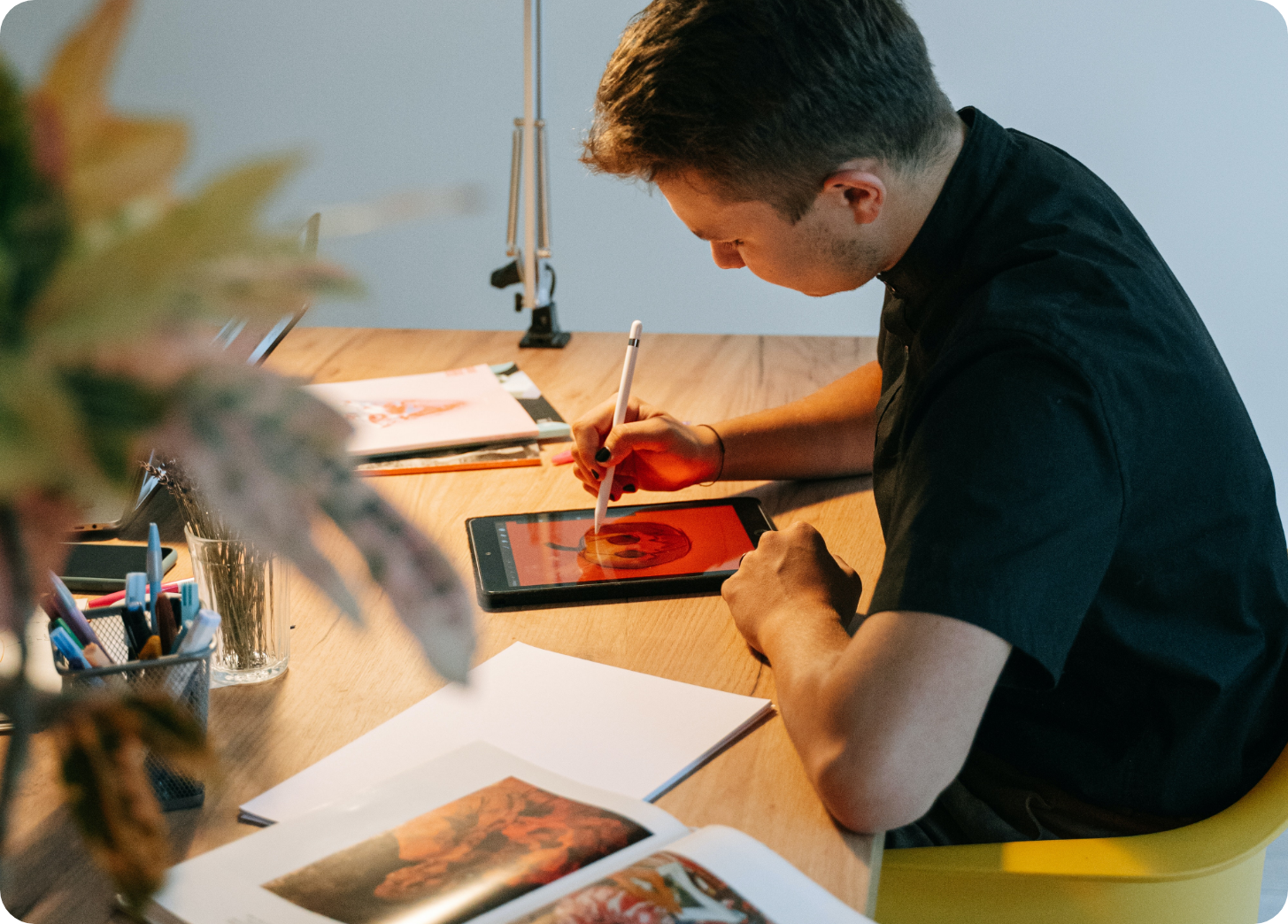 man working on graphic design project on tablet