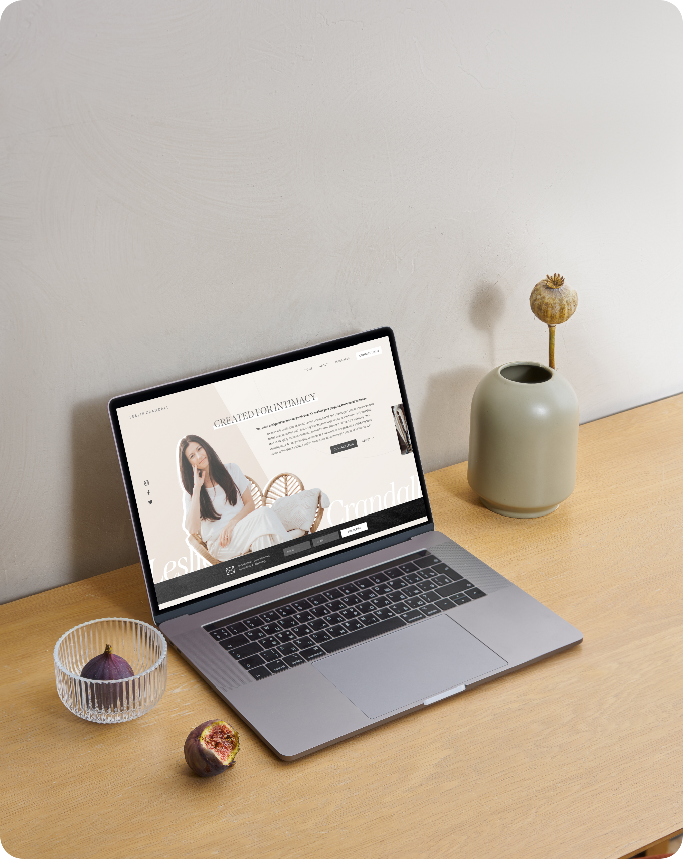 laptop on a desk showing Arrows & Bow's website homepage