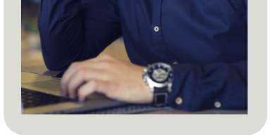 man's hands at a laptop keyboard