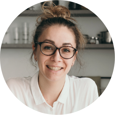 woman with glasses smiling