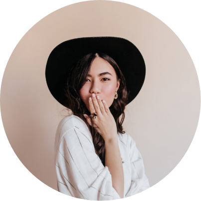 woman in hat looking at camera
