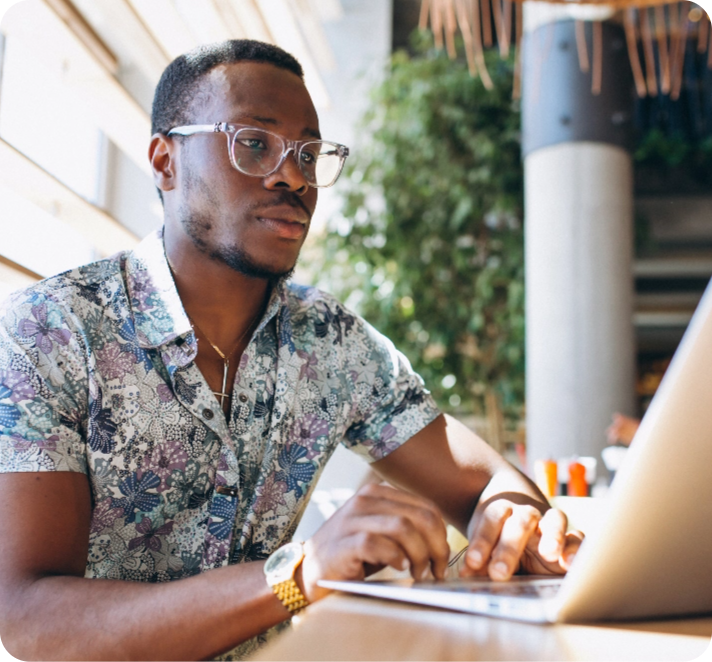 man looking at laptop screen showing data graphs