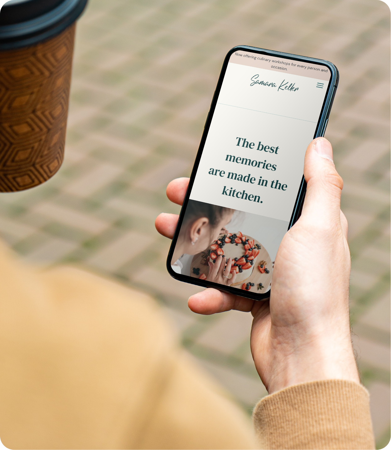 Samara Keller website template displayed on mobile as man holds cellphone