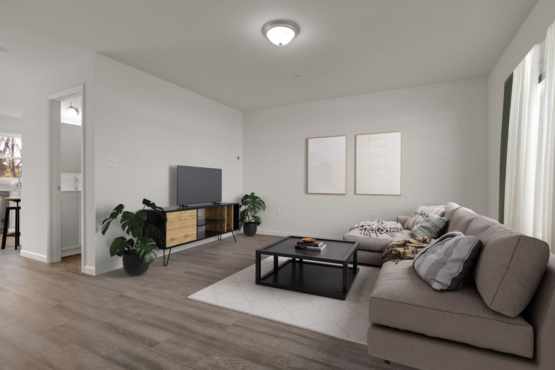 A living room with a couch , coffee table , and television.