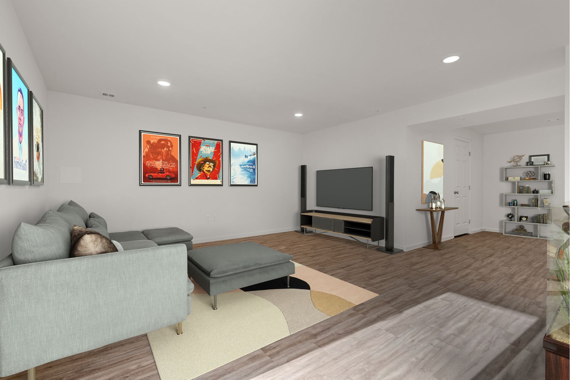 A living room with a couch , ottoman , and television.