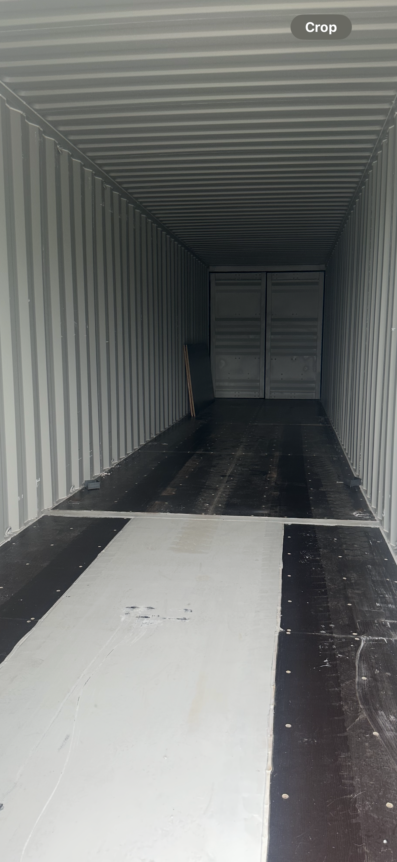 Inside of an empty shipping container, showing its corrugated metal walls and floor — Cairns Budget Storage In Mount Sheridan, QLD