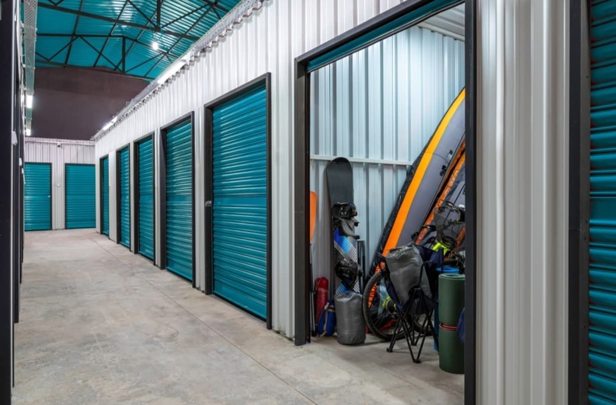 Storage Units In A Row, One Open Showing Sporting Equipment — Cairns Budget Storage In Mount Sheridan, QLD