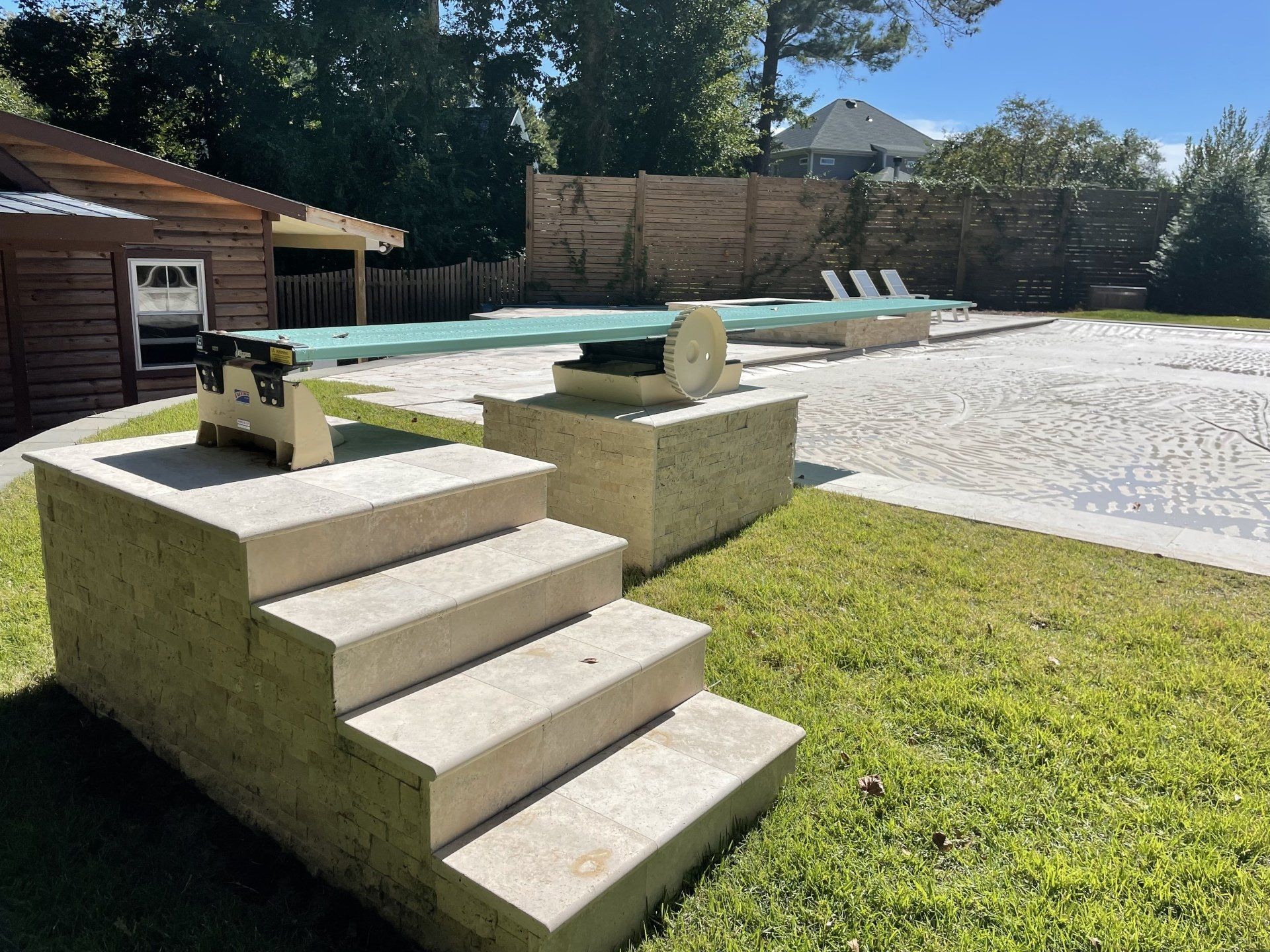 A set of stairs leading up to a swimming pool
