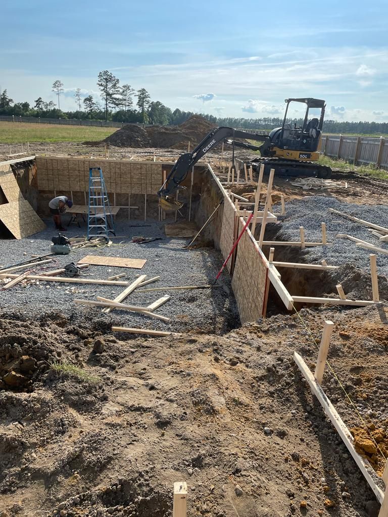 A construction site with a bulldozer in the background.