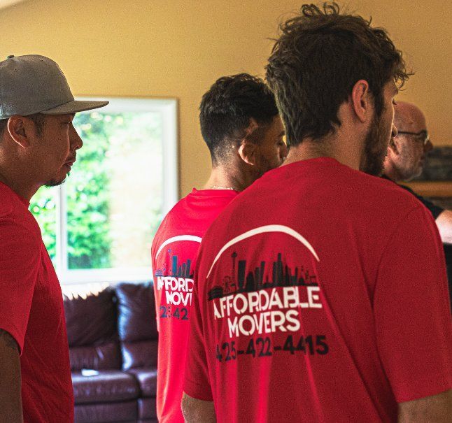 Movers wearing red shirts with 