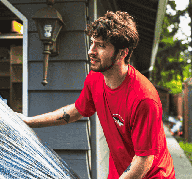 Affordable Movers member carefully carrying furniture during a move in Everett, WA.