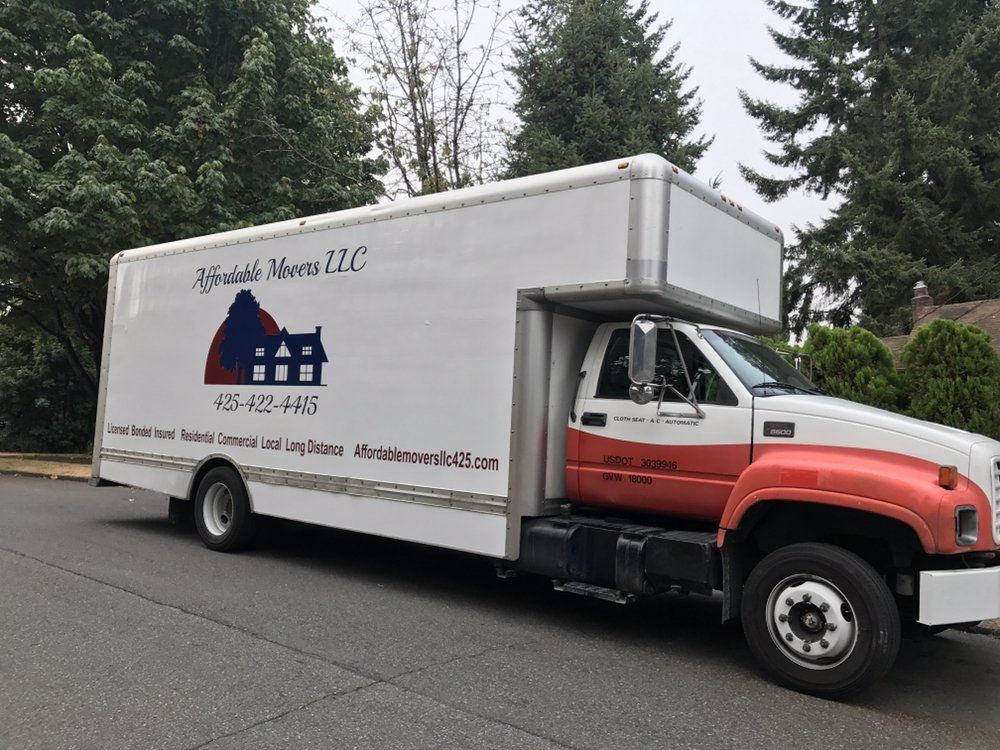 Moving truck on a street, branded with 