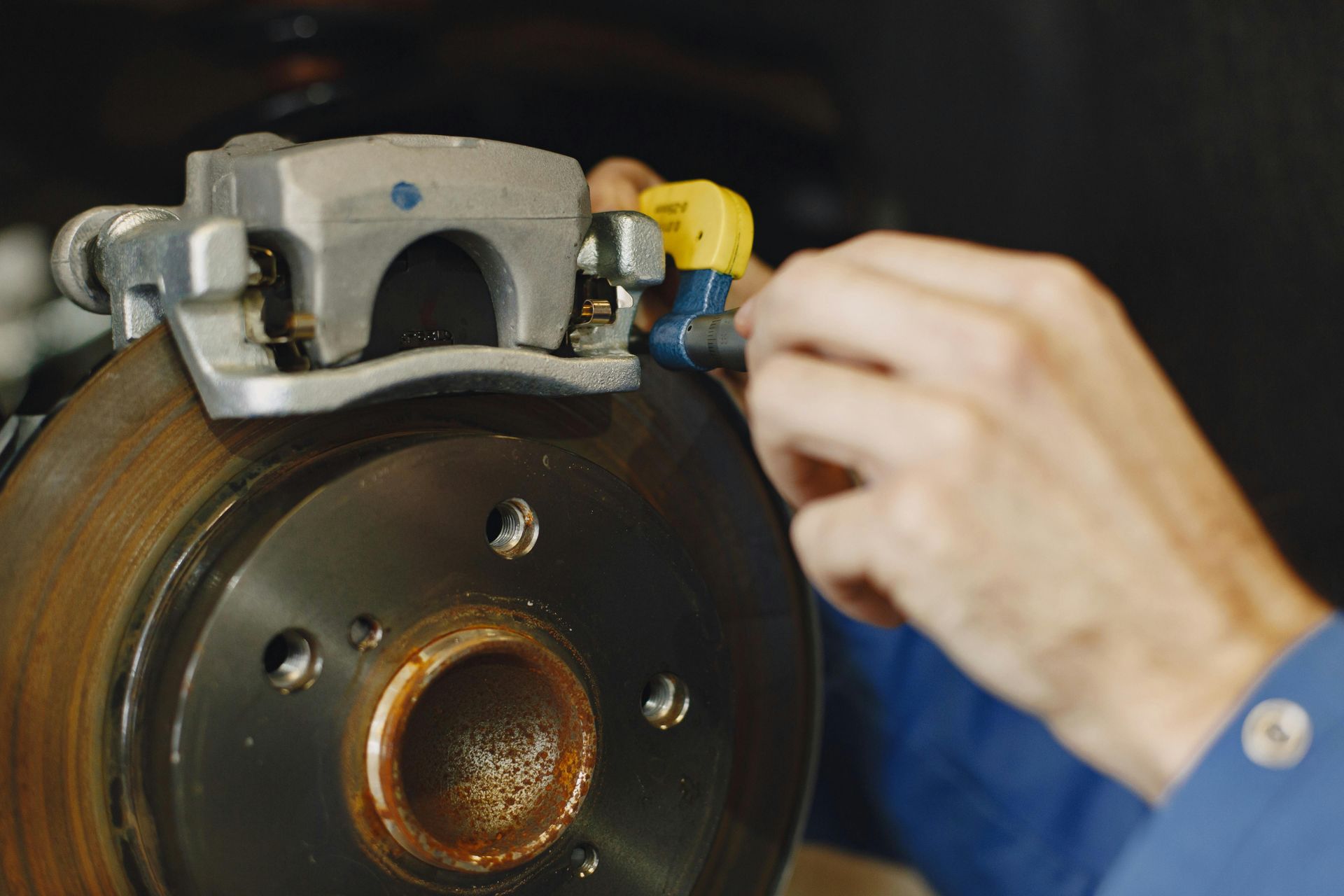 mechanic repairing brakes