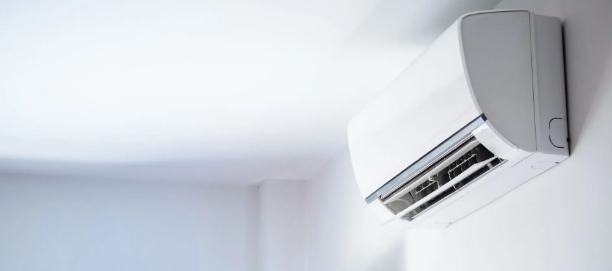 HVAC technician inspecting common AC issues in an Omaha, NE home to identify cooling problems and needed repairs. 